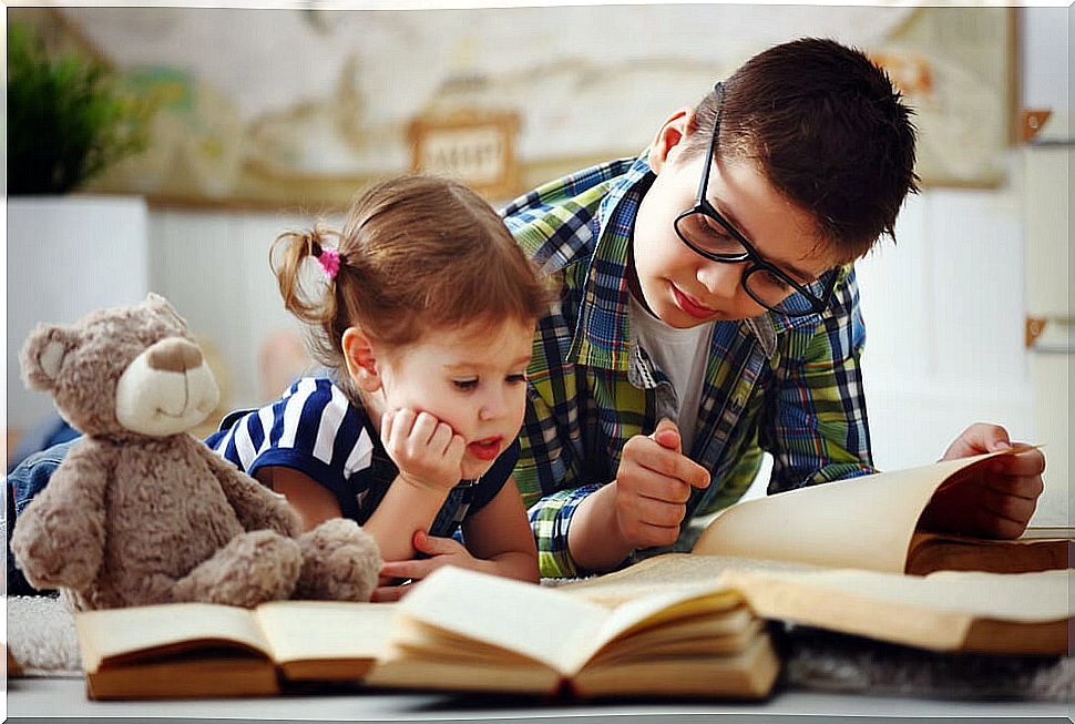 Brothers reading together.