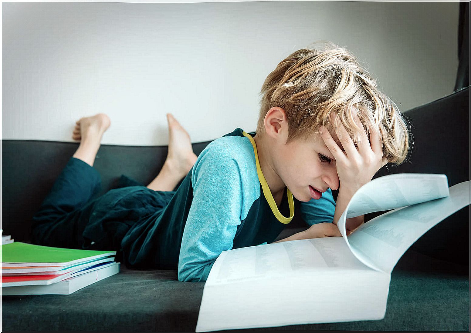 Child on the couch at home trying to keep calm before exams.