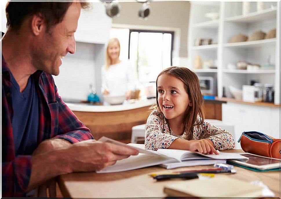 Father with his daughter conducting a homeschooling.