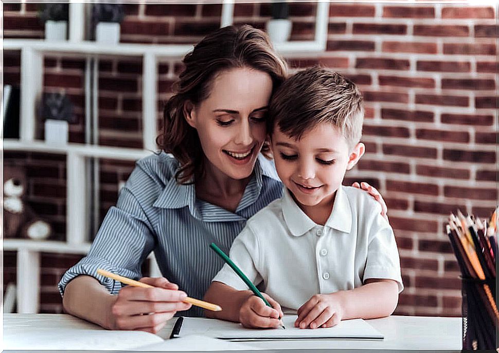 Mother and son doing homework at home.