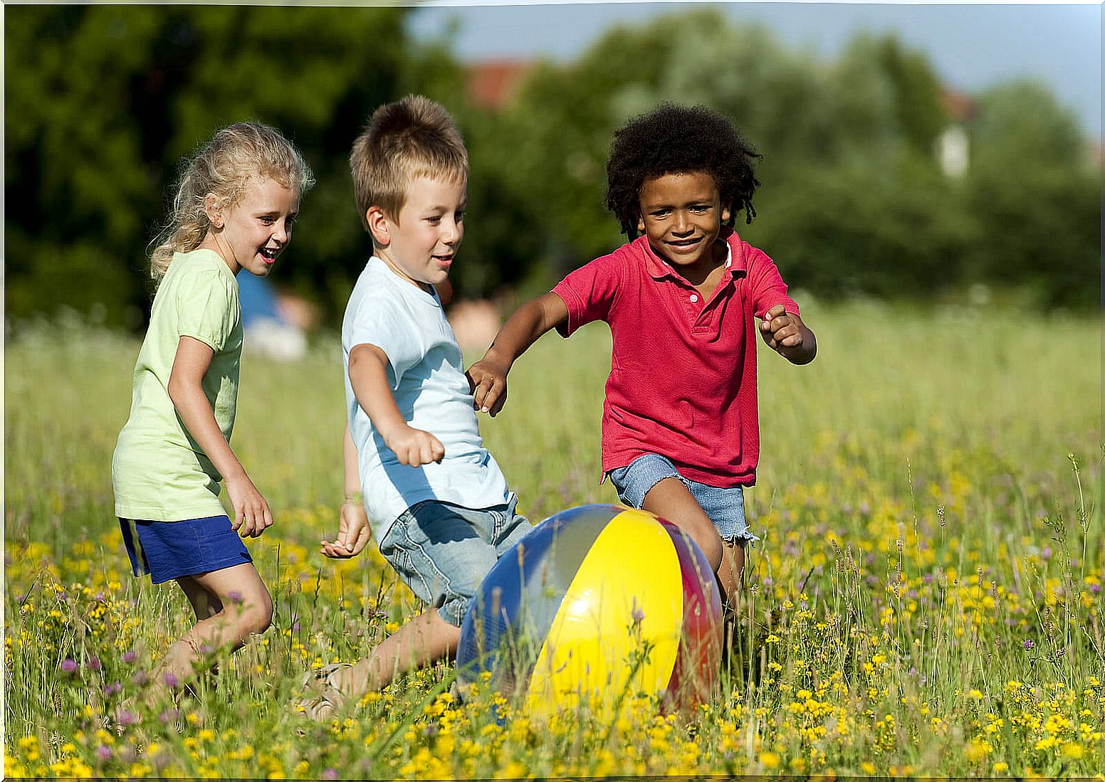 Children playing with the ball, one of the most productive social-emotional activities.