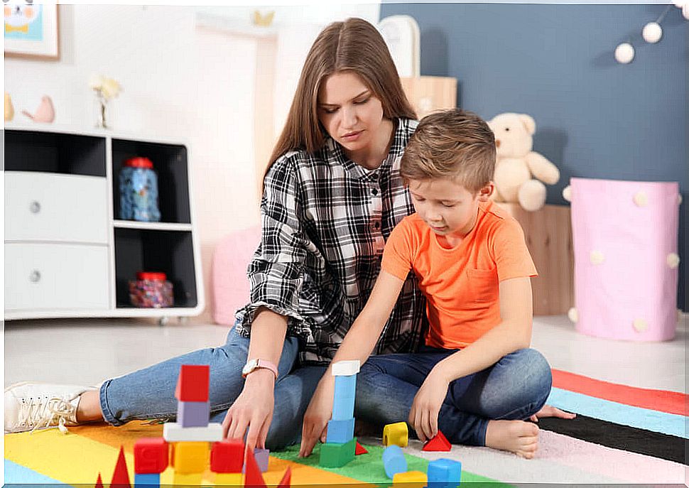 Mother doing some of the activities for children with autism with her son.