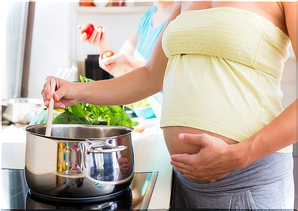 Pregnant woman following the basic rules of food safety.