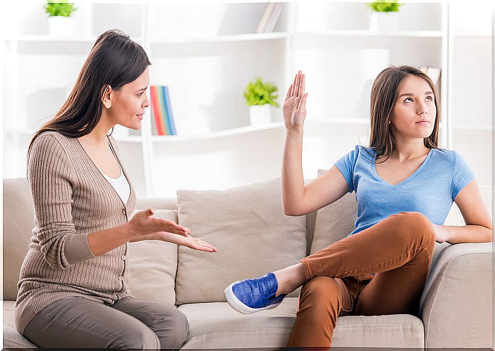 Mother trying to talk to her teenage daughter.