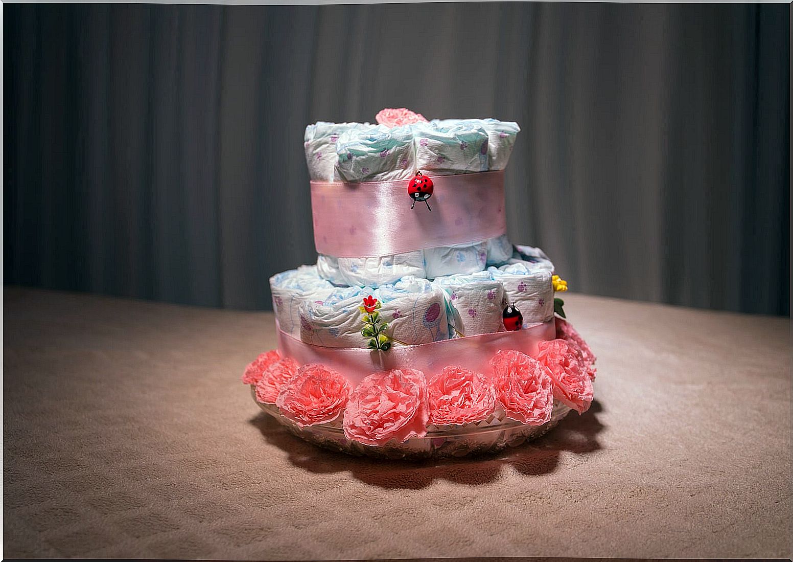 Pink diaper cake.