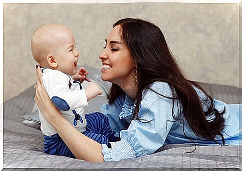 Mom conducting early stimulation exercises for premature babies with her son.