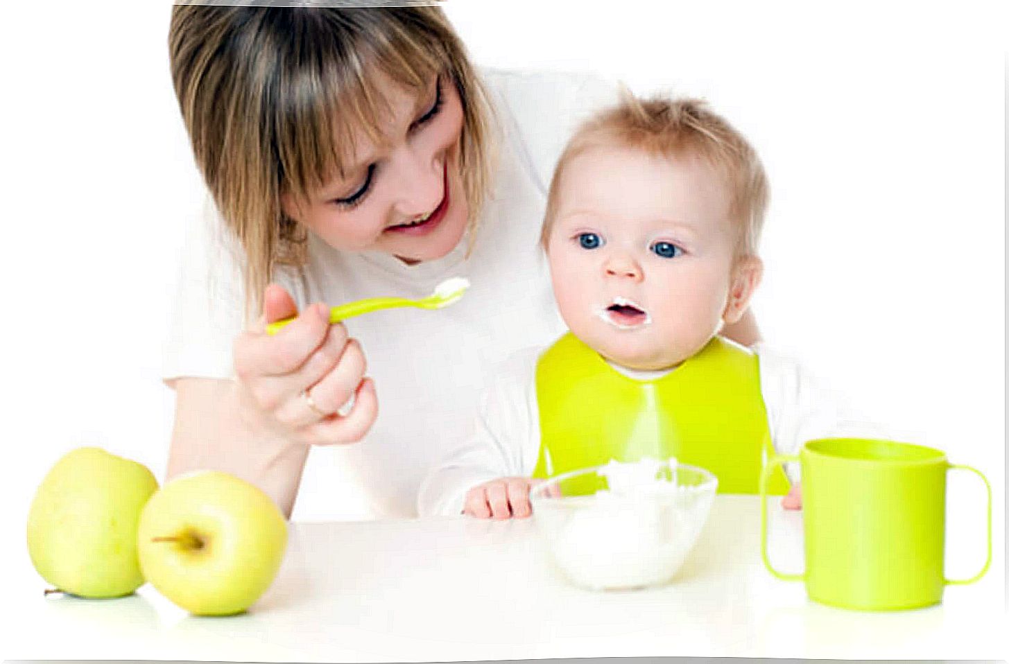 Baby taking porridge made from foods typical of a vegan diet.