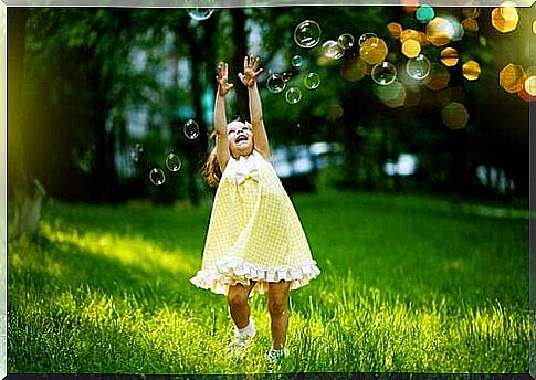 Girl-jumping-between-soap-bubbles