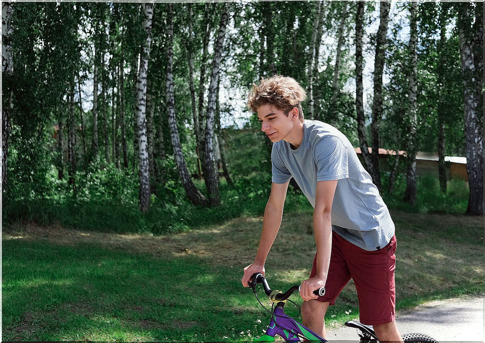 Teen riding a bicycle, one of the best non-competitive sports.