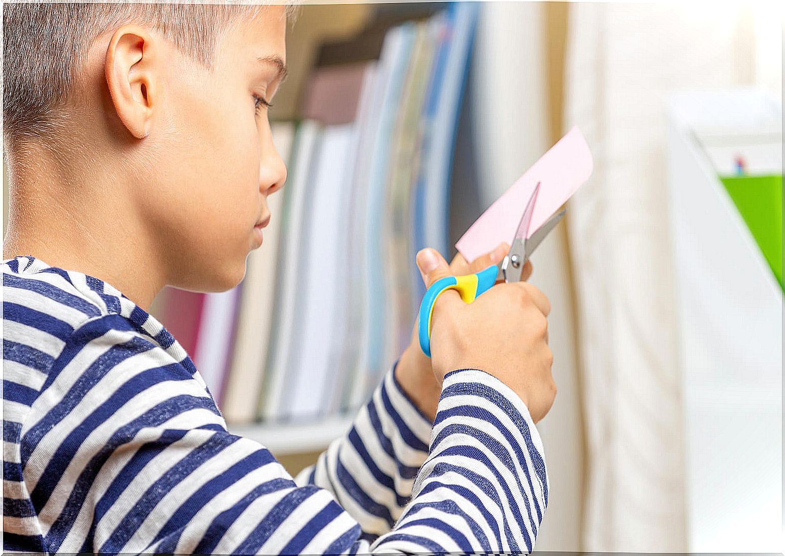 Child doing crafts to learn the time.