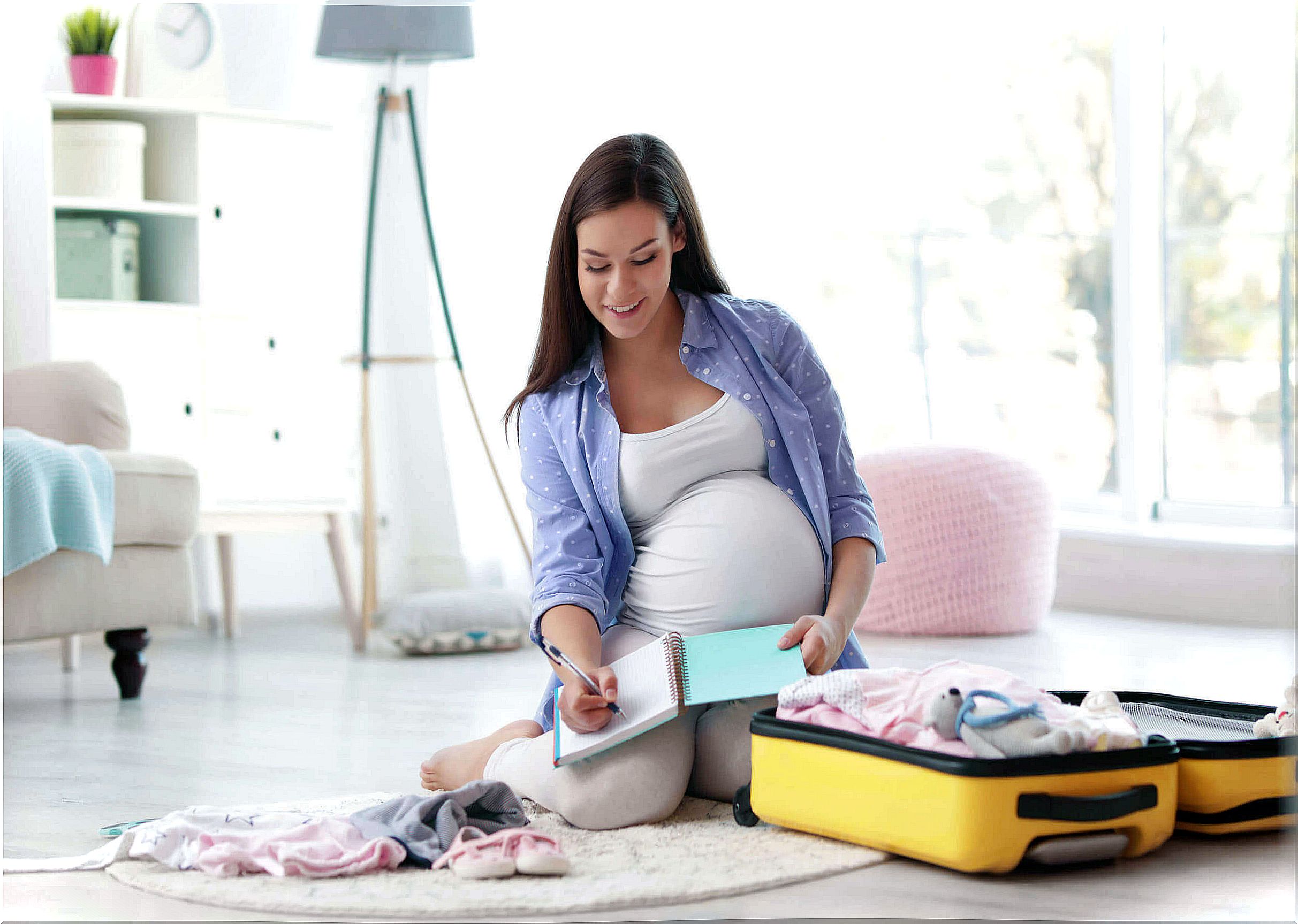 Woman preparing bag for hospital during week 36.